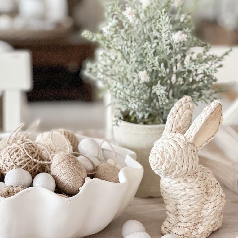 Embroidered jute material wrapped over a bunny figurine creating a monochrome stylish bunny decorative piece.